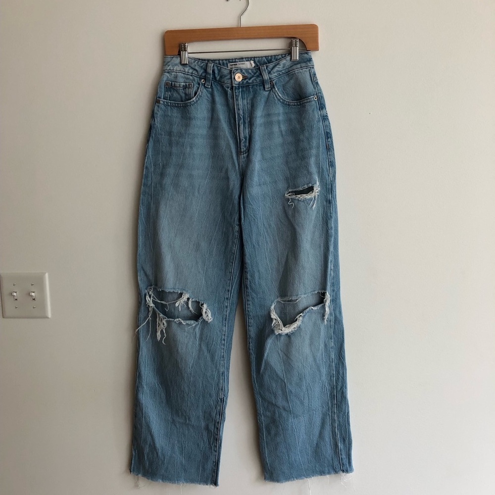 Garage denim distressed jeans with a raw hem